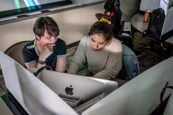 Student and professor in computer lab