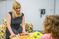 Adult sitting across from child