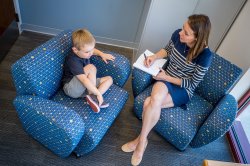 overhead view of a woman speaking with a child