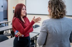 A Family Science and Human Development student speaks with her professor.