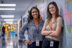Two educational administrators pose together in a school.