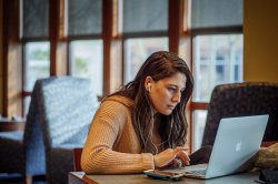 student focused on laptop