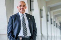 A future leader in criminal justice, standing confidently.