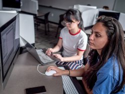 Students collaborating in a lab setting.