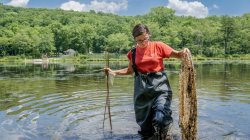 student dragging net in new jersey school of conservation