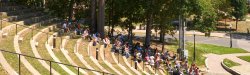 class being taught in the amphitheater on a sunny day