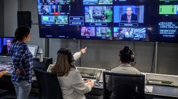 students in television control room managing a live broadcast