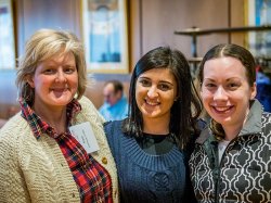 women pose for photo