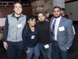 Alumni at happy hour