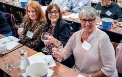 women holding glasses of wine