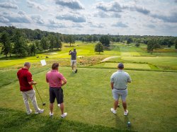 Four golfers at Crestmont Country Club