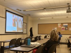Presenter in front of projector