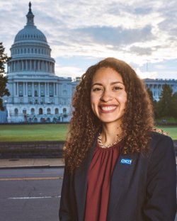Photo of Isabella Paz Baldrich on the lawn across the street from the U.S. Congress building