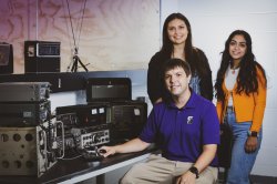 old photo of students posing with radio equipment