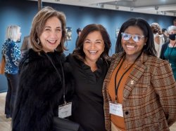 Women pose for a photo.