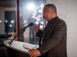 Man speaking at podium.