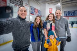 Group takes a selfie on the ice.