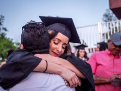graduate embracing parent at convocation