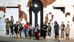 Students posing in front of wall in Puerto Rico