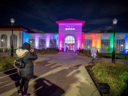 School of Communication and Media lit up with rainbow colors