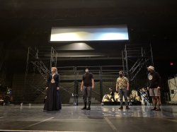 Performers in face masks rehearse in Memorial Audiotorium