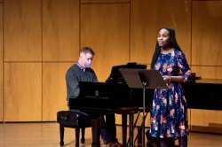 Vocalist Imani Achokah performs at the December Cali showcase, accompanied by collaborative pianist Michael Caldwell.