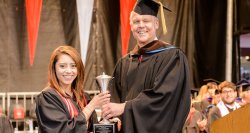 Dean Gurskis presenting award to student at convocation