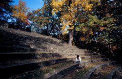 Image of a student sitting in the amphitheater