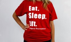 Red short sleeve shirt that says eat sleep lift campus recreation