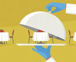 Photo of a restaurant table under a silver server.