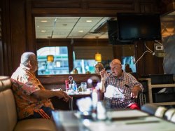 People wait for their breakfast inside of a local diner, in Hoboken, New Jersey in September after the state cleared restaurants for indoor dining at 25% capacity. EDUARDO MUNOZ ALVAREZ/AP/SHUTTERSTOCK