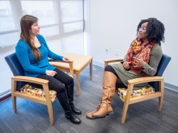 Two women talking at the Center for Clinical Services