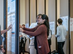 Students set up posters to showcase their research.