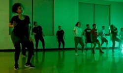 students dancing in green room