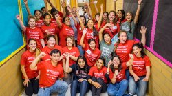 group of alumni volunteers in hallway