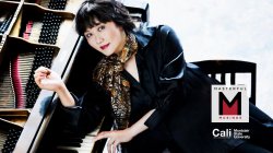 Woman laying on piano