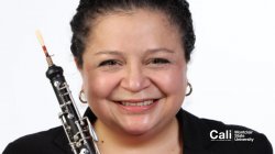Woman with oboe smiling