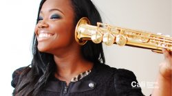 Woman with Saxophone up to Ear