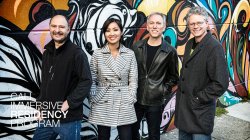 Photo of Quartet in front of Graffiti Wall