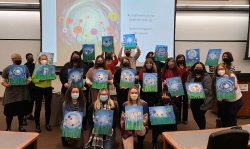 Photo of CEHS faculty and staff with their finished paintings