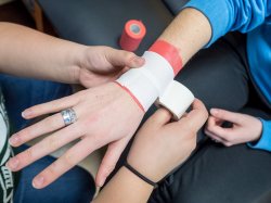 Photo of wrist being bandaged
