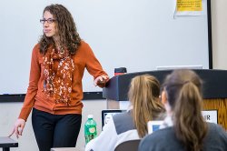 Photo of Dr. Lauren Dinour Teaching in the Classroom