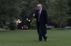 President Donald Trump gives the thumbs-up as he walks from Marine One to the White House in Washington, Thursday, Oct. 1, 2020, as he returns from Bedminster, N.J. Caroly Kaster, AP