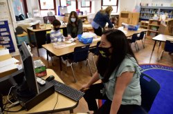 Daniela Rutz, a Kindergarten teacher at School Number 5, instructs her classroom and students at home at the same time using video conferencing and smart boards in Cliffside Park, NJ on Friday September 18, 2020. Tariq Zehawi/NorthJesey.com
