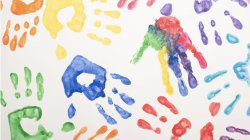 Photo of painted handprints on white paper