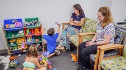 Parents and children playing in the waiting room