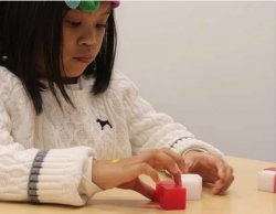 A research participant plays a game as part of the study on spatial ability.