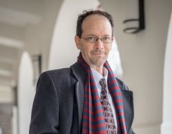photo of Professor Ian Drake outside with jacket and scarf