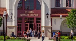 exterior of Feliciano School of Business building with people entering and exiting the building