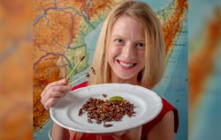 Photo of Cortni Borgerson with bugs on a plate